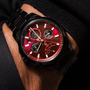 SOVRYGN Calendar Midnight Edition watch with crimson dial, matte black case, and red‑gold accents - Back View
