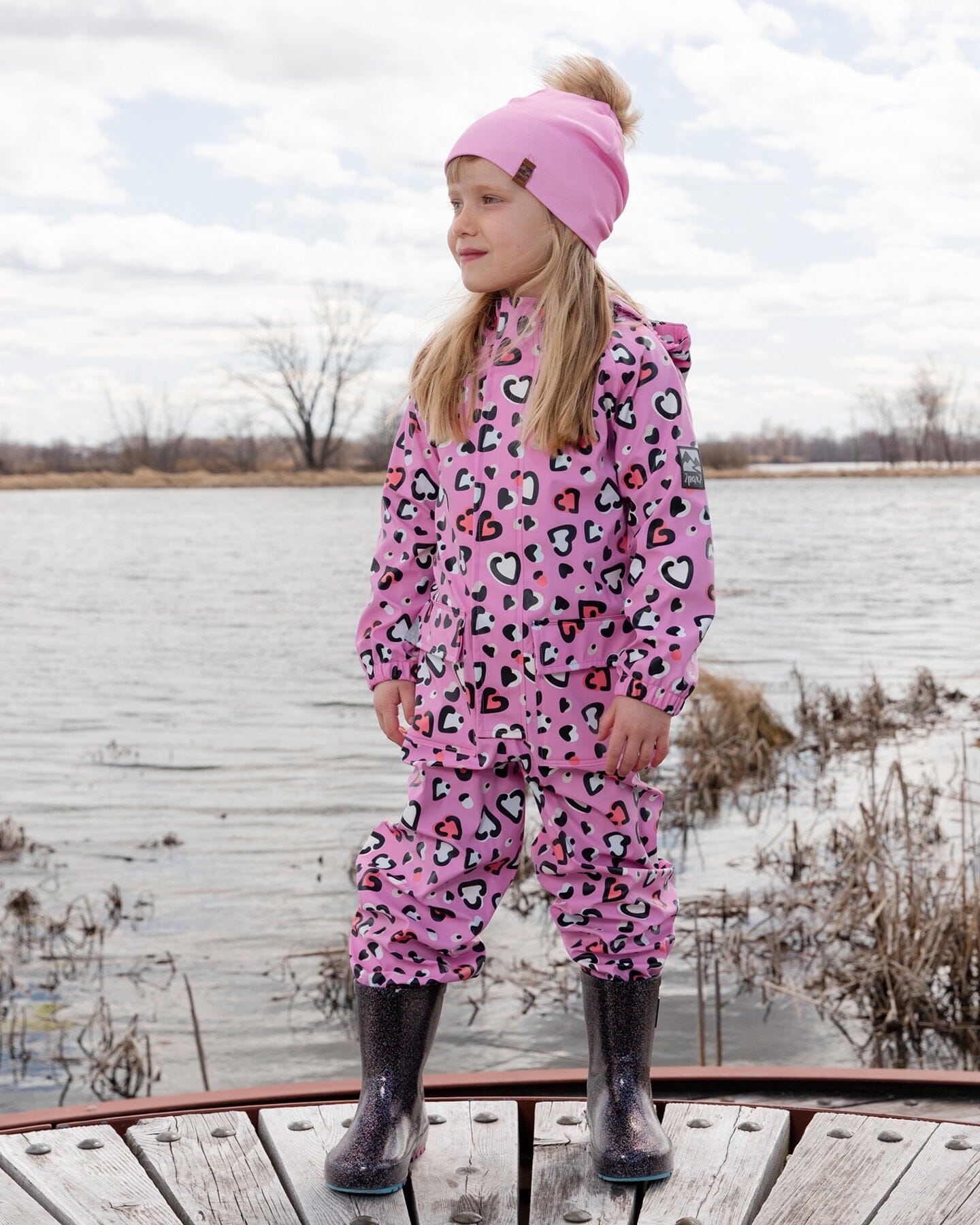 Pink rain jumpsuit with color-changing hearts print - Image 2
