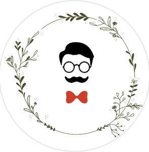Smile Boutiques logo featuring minimalist black silhouette of a man with glasses, mustache, and red bow tie, surrounded by a delicate circular wreath of green botanical elements.